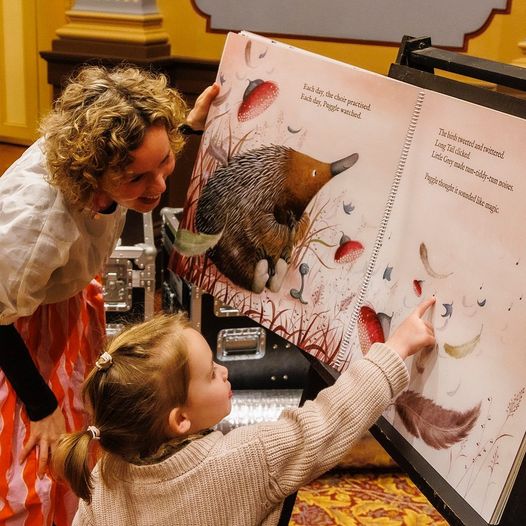 Vikki Conley reading with a small child