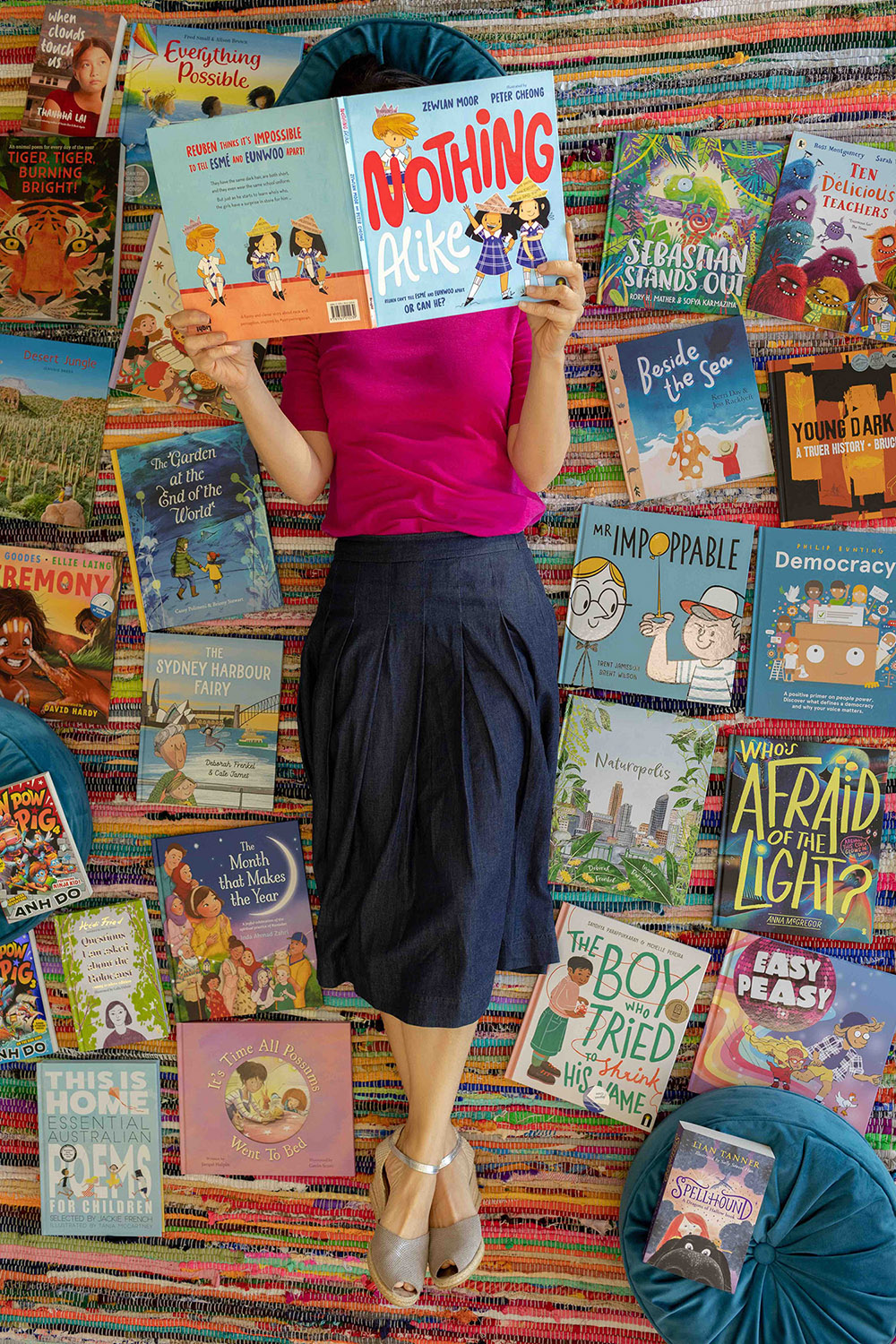 Zewlan Moor surrounded by books portrait